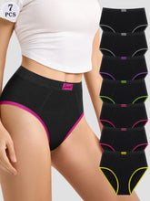 Woman wearing black underwear with colorful trim, surrounded by additional black underwear pieces on a white background.