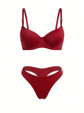 A two-piece bikini set in a deep red color, featuring a structured underwire bra top with thin shoulder straps and matching high-cut bikini bottoms with a front keyhole cutout, displayed against a solid white background.