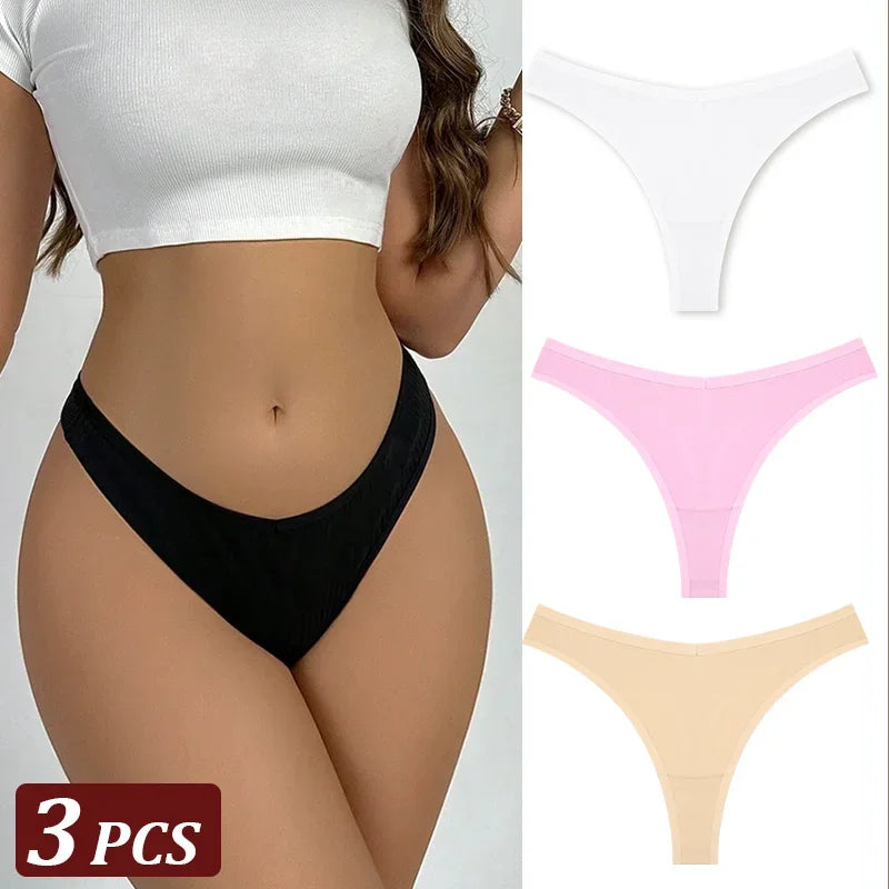 Black thong worn by a person with additional thongs in pink and beige displayed on a white background.