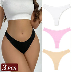 Black thong worn by a person with additional thongs in pink and beige displayed on a white background.