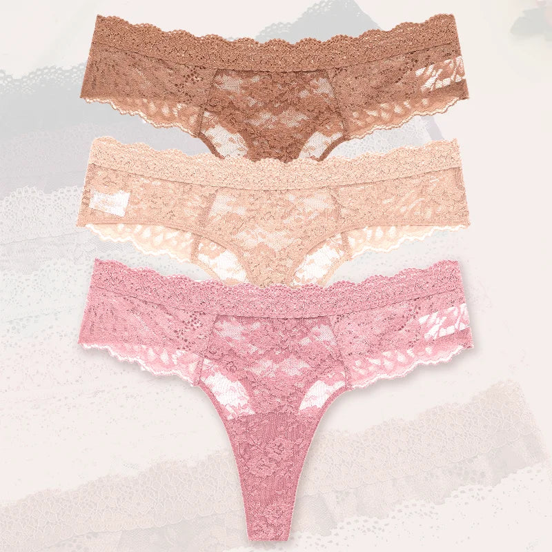 Three pairs of lace underwear in different colors on a textured white background