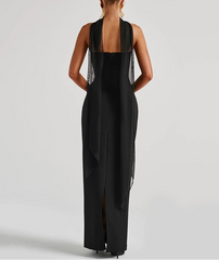 Black sleeveless dress with open back on a white background