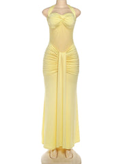 Yellow evening gown on a mannequin against a white background