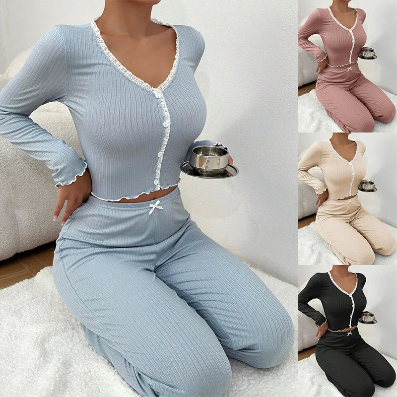 Woman wearing a light blue ribbed outfit sitting on a white rug.