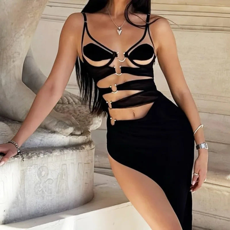 Woman wearing a black strappy top and skirt in an indoor setting