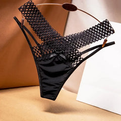 Black lace lingerie set on a neutral background