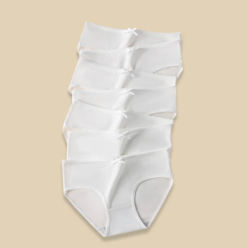 White shapewear on a beige background