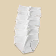 White shapewear on a beige background