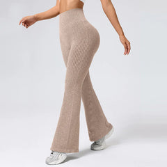 Beige ribbed knit pants worn by a person on a white background