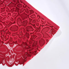 Close-up of red lace fabric on a white background