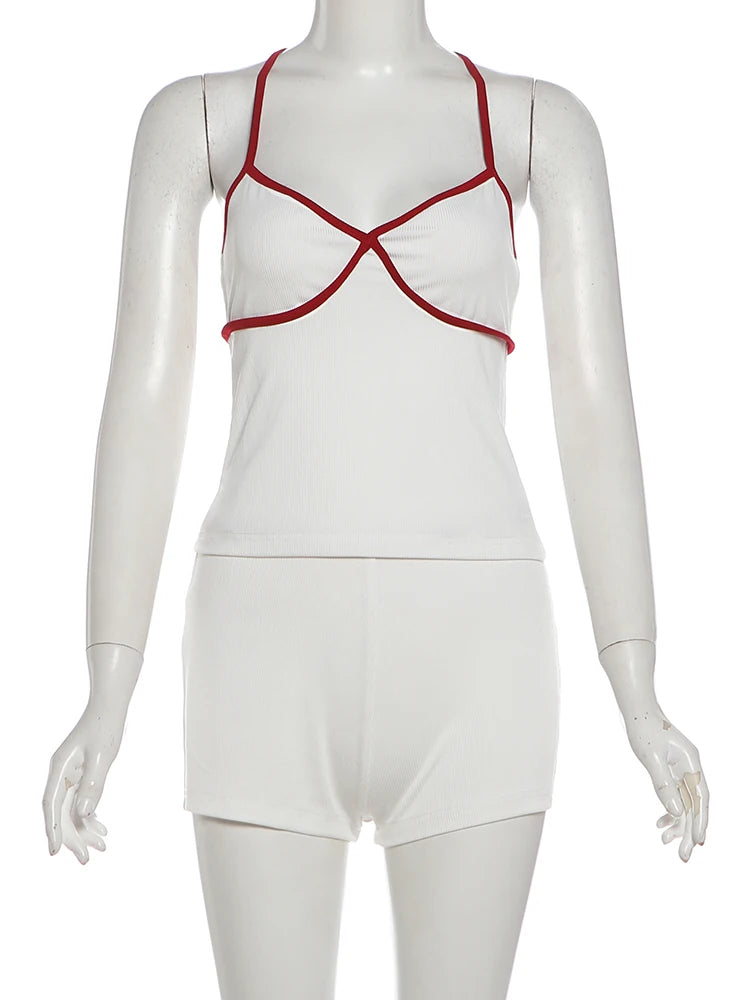 White swimsuit with red straps on a mannequin against a white background
