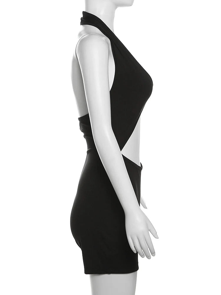 Black dress on a mannequin with 'WeirdPuss' branding.