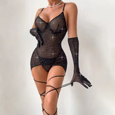 Black sheer lingerie set with rhinestones and matching gloves on a white background