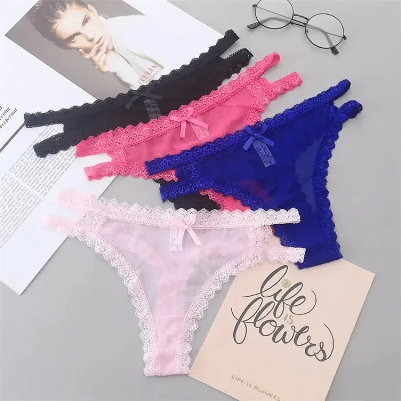 Four pairs of colorful lace-trimmed panties on a gray surface with a 'Life is Flowers' card.
