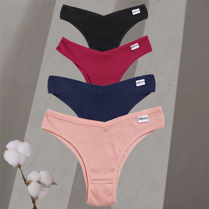 Four pairs of women's underwear in black, red, blue, and pink on a gray background with cotton branches.