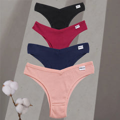 Four pairs of women's underwear in black, red, blue, and pink on a gray background with cotton branches.