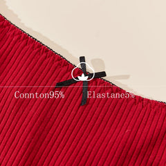 Close-up of red fabric with a black zipper and text indicating material composition.
