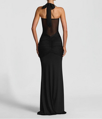 Black evening gown with sheer back on a white background