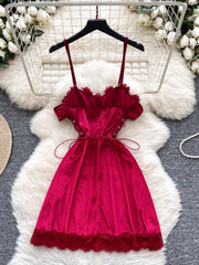 Red dress on a hanger with a white floral background