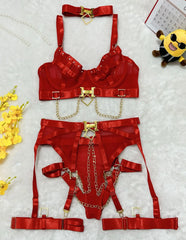 Red lingerie set with gold accents on a light gray background