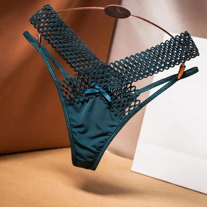 Teal lace lingerie set on a hanger against a neutral background