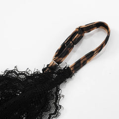 Black lace fabric with a brown handle on a white background