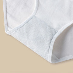 Close-up of a white bra on a beige background