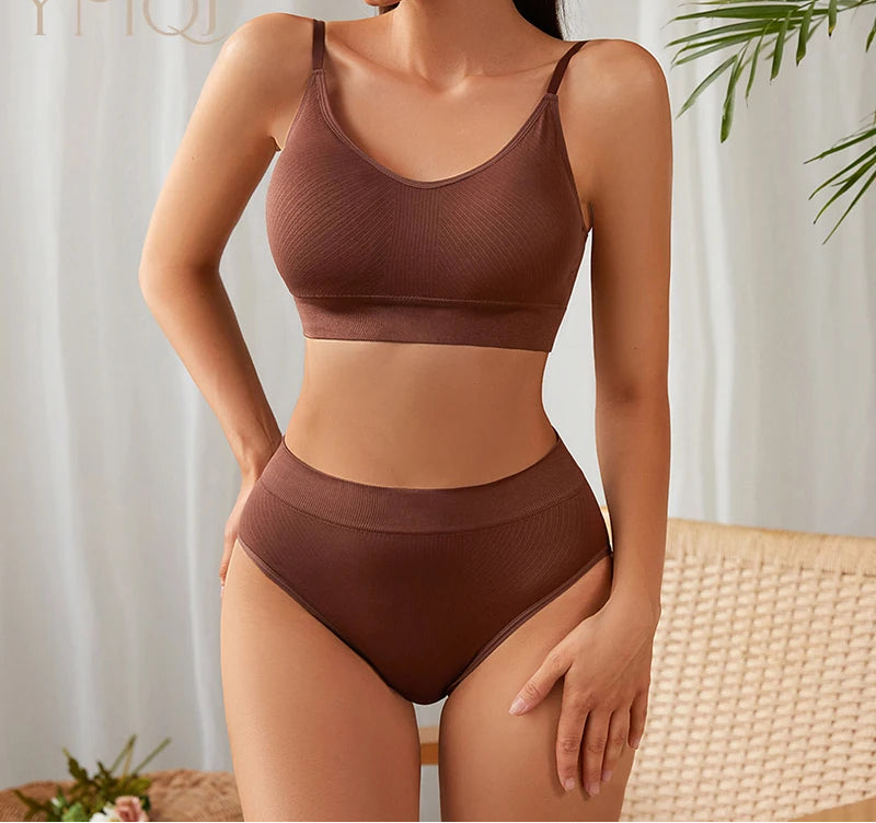 Woman wearing a brown bikini set with a neutral background