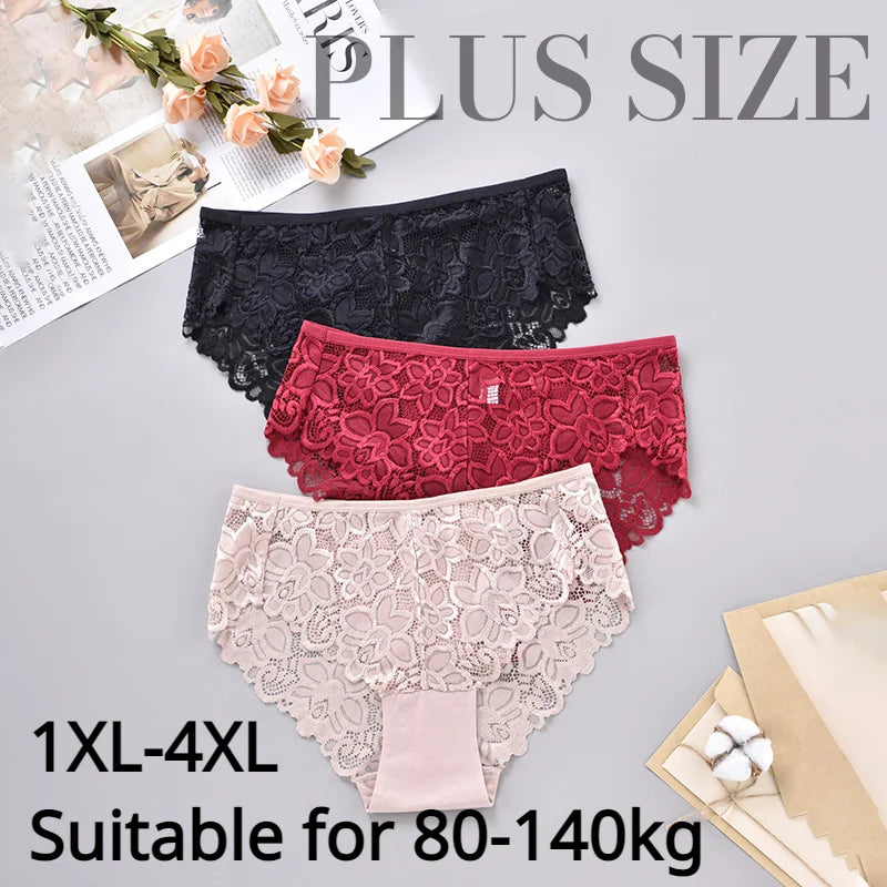 Three pairs of plus size lace panties on a gray surface with text indicating size range.