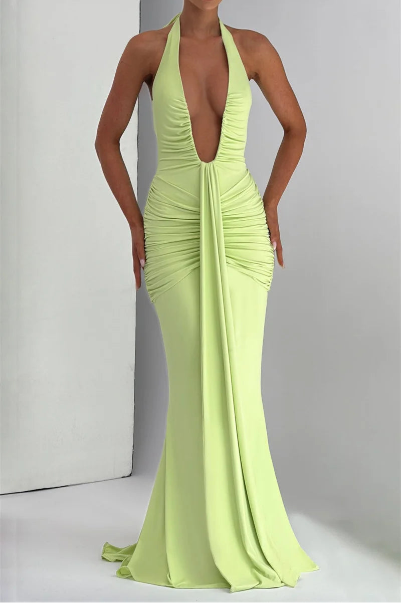 Lime green evening gown with a plunging neckline on a plain background