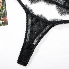 Black lace lingerie set on a white background
