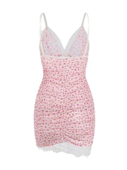 Pink floral dress with lace trim on a white background