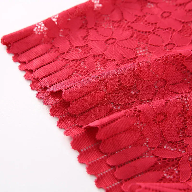 Close-up of red lace fabric on a white background