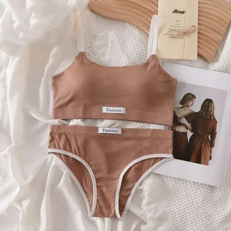 Brown ribbed bikini set with 'Fashion' label on a textured white surface.
