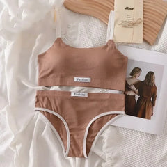 Brown ribbed bikini set with 'Fashion' label on a textured white surface.
