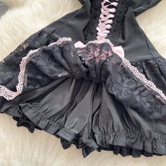 Black lace lingerie set on a light background