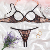 Leopard print lingerie set on a white fabric background with flowers and jewelry.