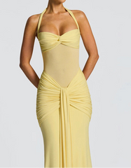 Yellow evening gown on a plain background
