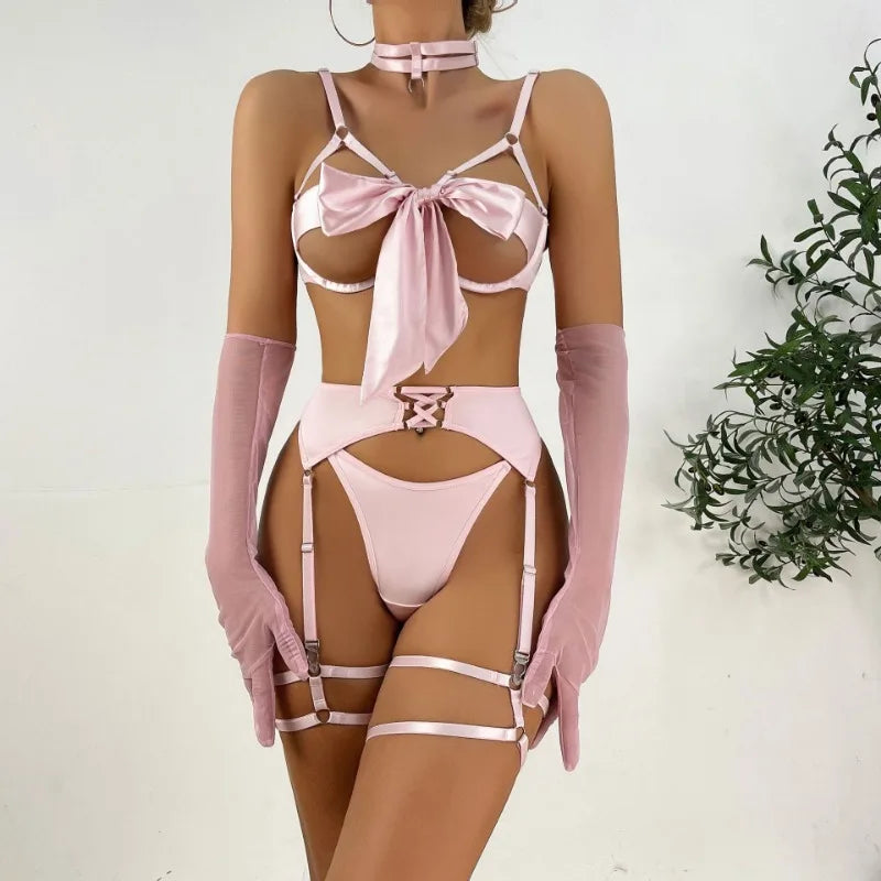 Pink lingerie set with matching gloves on a white background