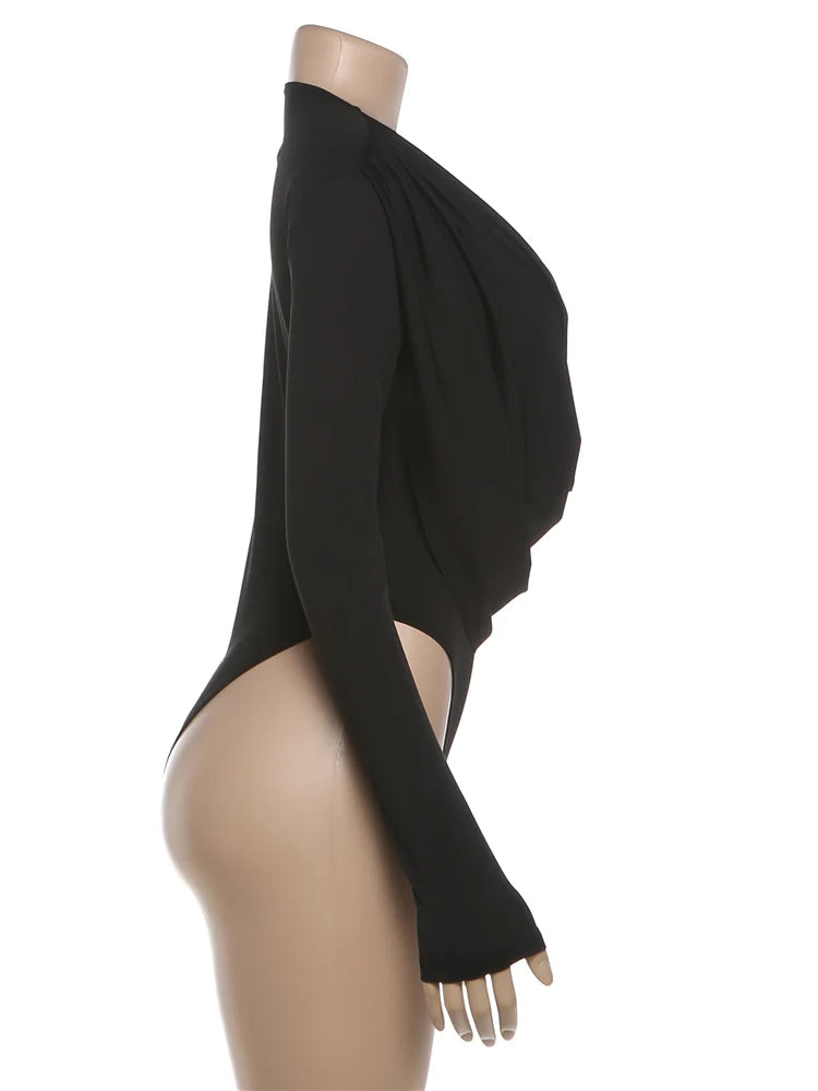 Black long-sleeve top on a mannequin against a white background