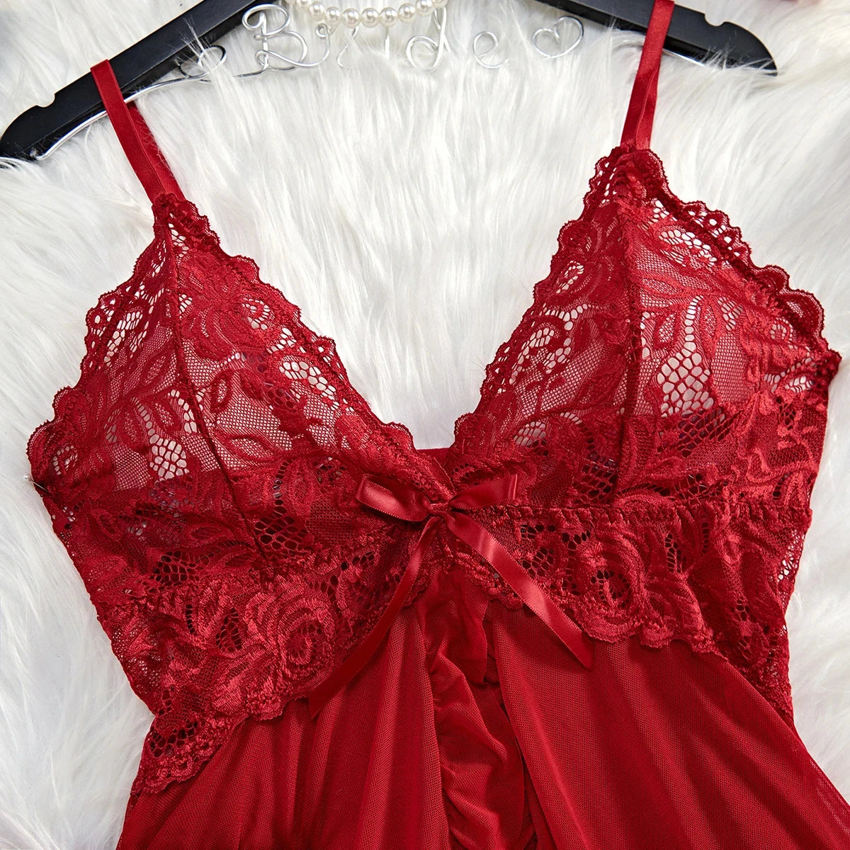 Red lace lingerie set on a white background