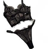 Black lace lingerie set on a white background
