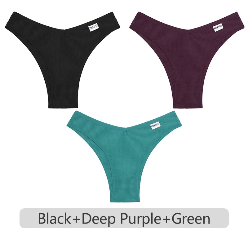 Three pairs of underwear in black, deep purple, and green on a white background.