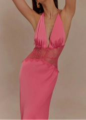 Pink dress with sheer overlay on a beige background