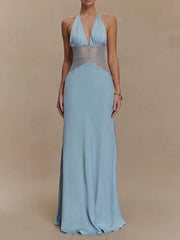 Light blue evening gown with sheer bodice on a beige background