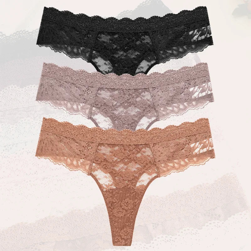 Three pairs of lace underwear in black, gray, and brown on a textured white background.