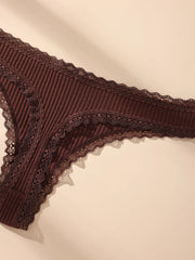 Brown lace lingerie on a beige background