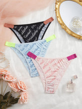 Three pairs of women's underwear with floral patterns on a white surface with decorative elements.