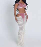 Woman wearing a pink top and white skirt on a white background