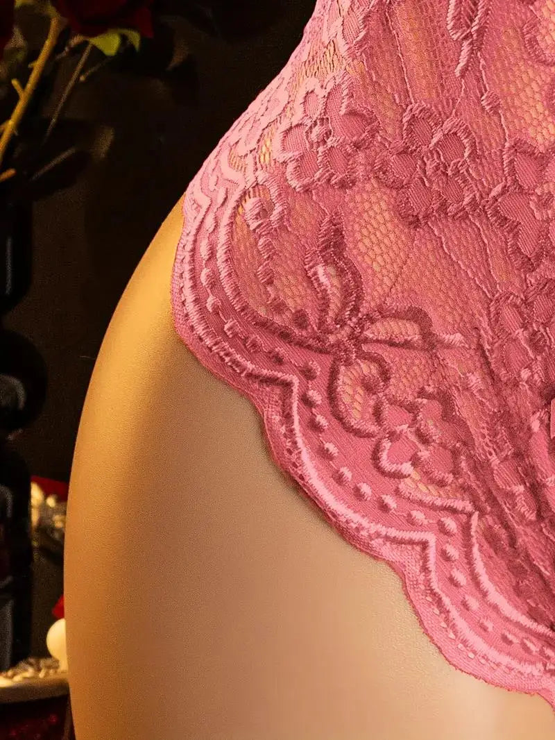 Close-up of a pink lace garment on a blurred background